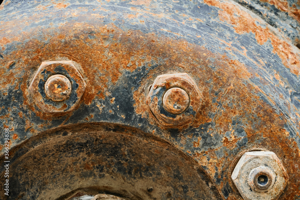 big wheel close view of old tractor as background