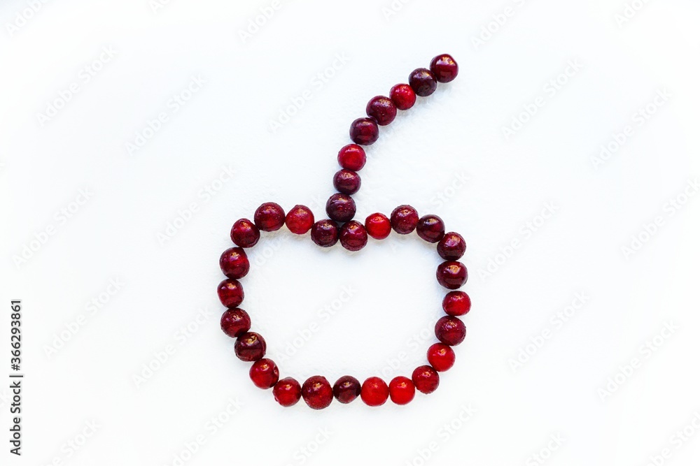 Red cherry ripe juicy on a white background. Red cherry ripe juicy on a white background.