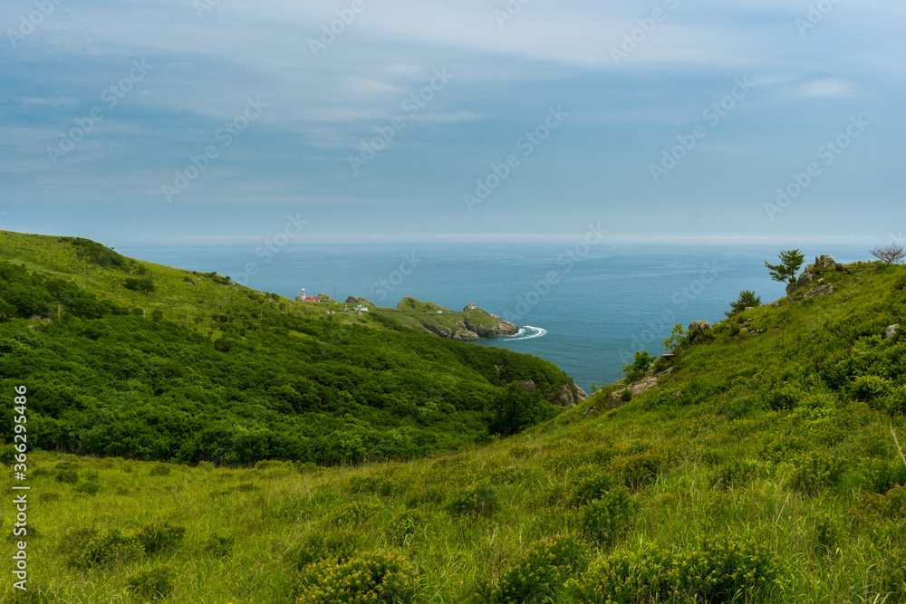 Ocean and green hills view