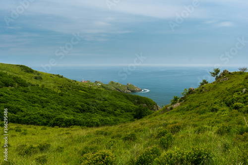 Ocean and green hills view