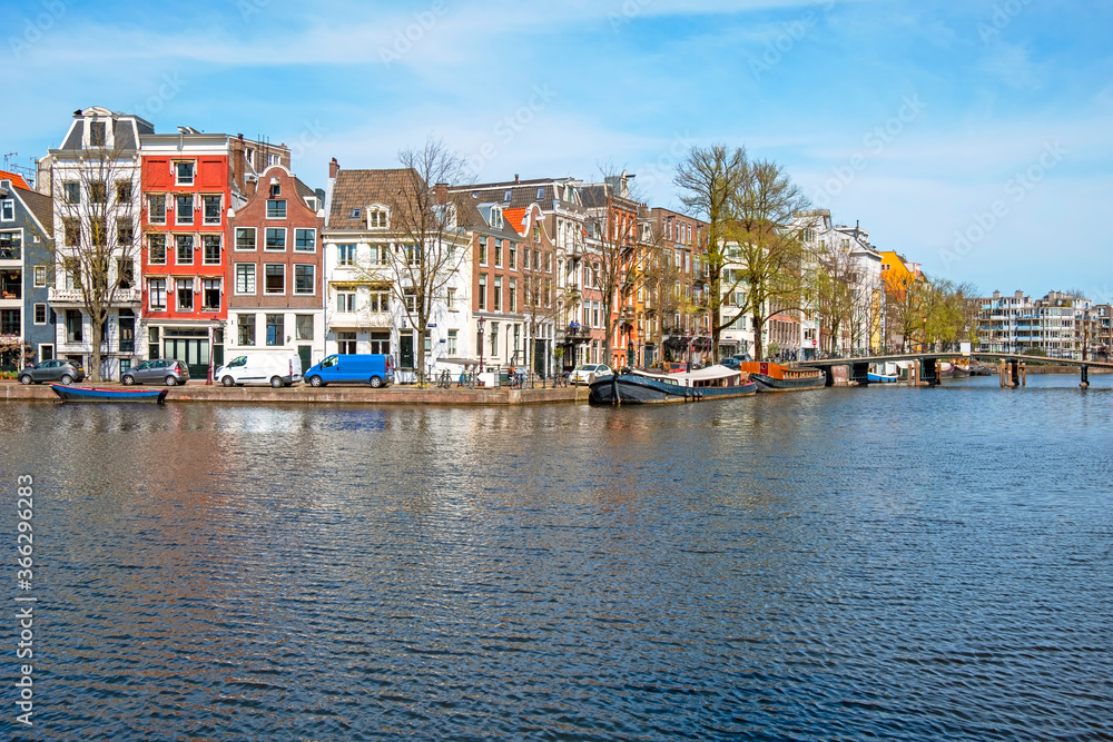 Medieval houses along the river Amstel in Amsterdam the Netherlands