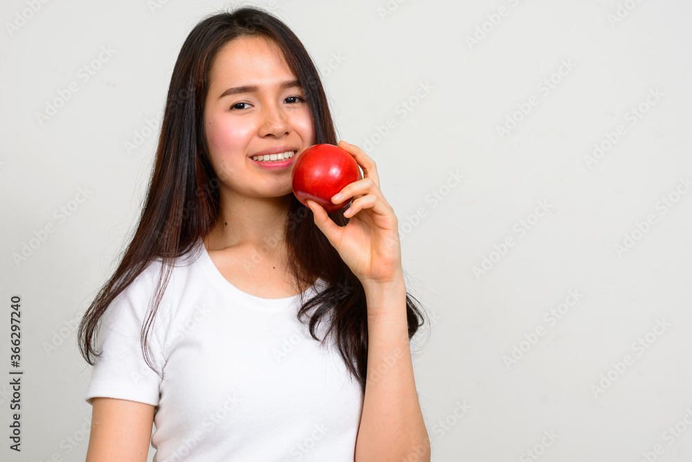 Portrait of happy young beautiful Asian woman Portrait of happy young beautiful Asian woman