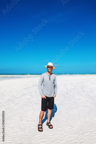 Smiling man on sand bank © Artem Popov