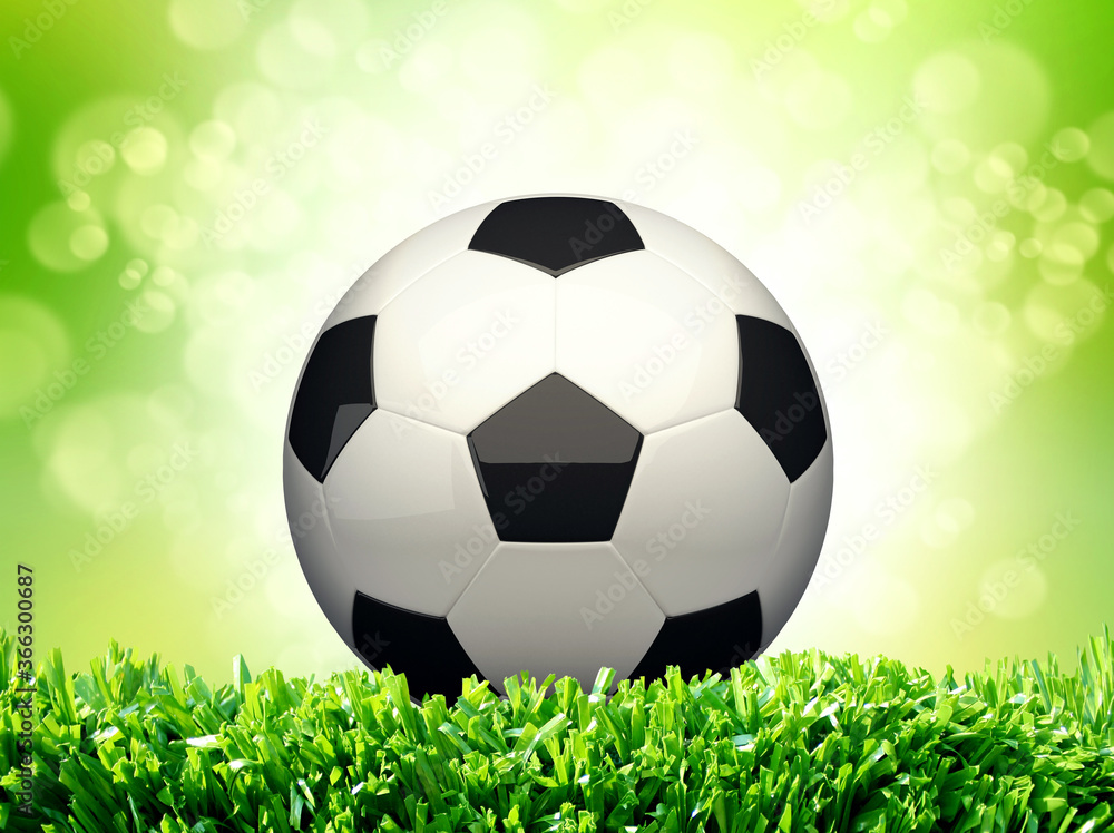 Naklejka premium Football on green grass