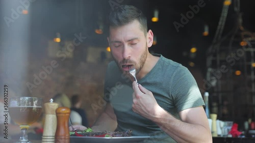 Man Eating Food At Restaurant, Male Enjoying Grilled Barbecue Meat Steak In Cafe