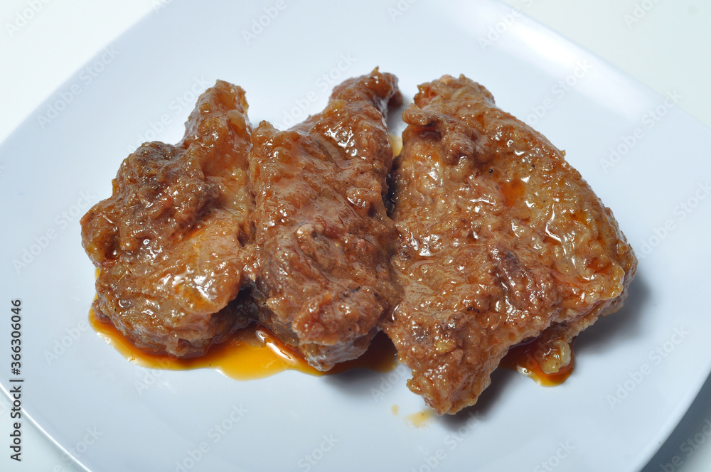 Rendang, an Indonesian spicy meat dish originating from the Minangkabau region in West Sumatra Rendang, an Indonesian spicy meat dish originating from the Minangkabau region in West Sumatra