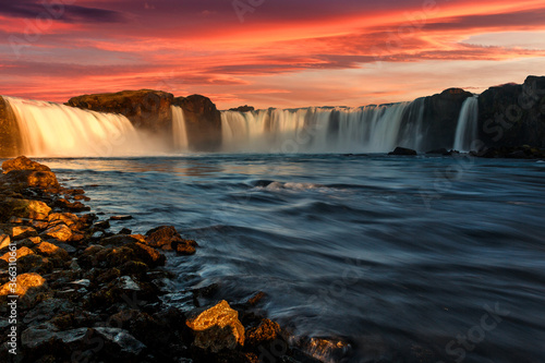 Fantastic nature landscape of Iceland during sunset. Wonderful View on Godafoss Waterfall with colorful sky. Travel on car is a Lifestyle, conception. Idea of Adventure lifestyle. Popular travel place
