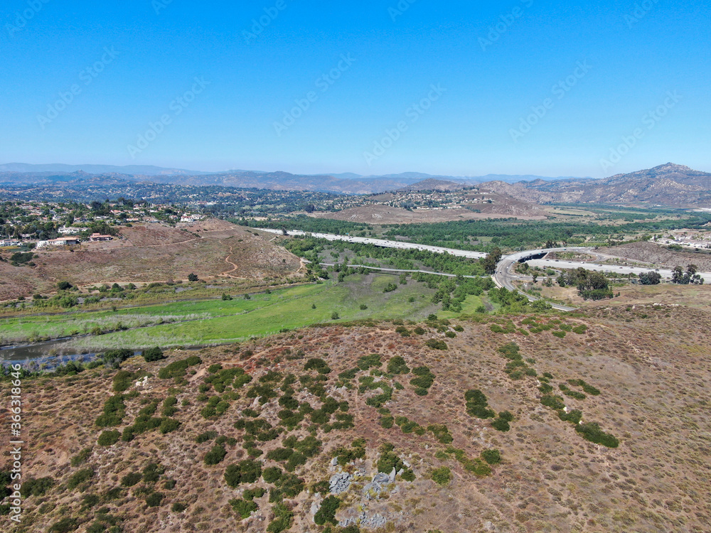 Aerial view of Rancho Bernardo mountain with freeway road on the background, East San Diego County, California, USA 