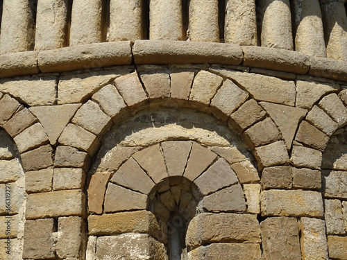 Detail of ashlars and Voussoirs. Apse of the Mozarab Pre-Romanesque or Romanesque Church of San Pedro de Larrede. Serrablo Region. 10th-11th century. Aragon. Spain.   photo