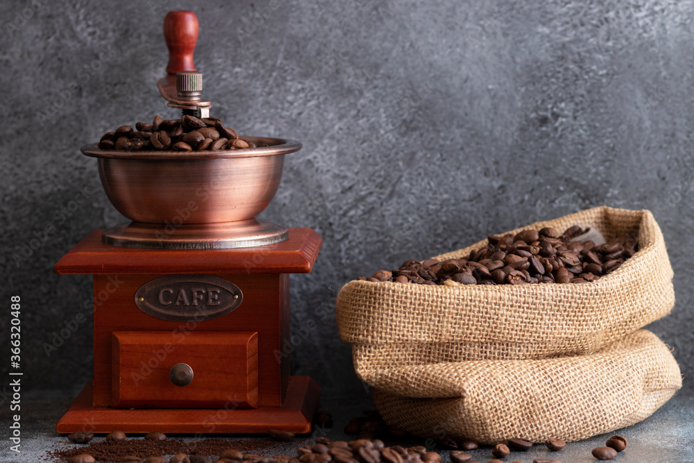 Coffee beans and a wooden grinder