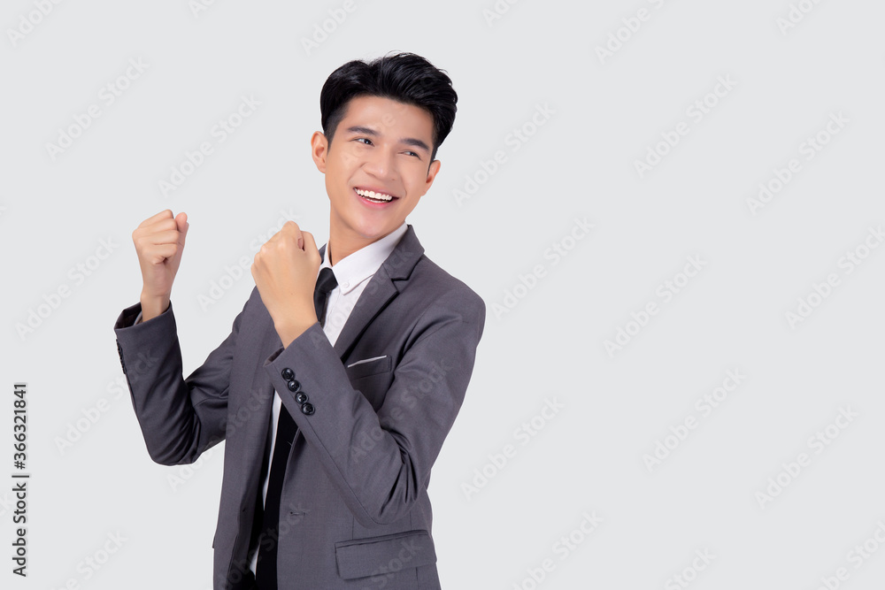 Portrait businessman in suit standing with win success isolated on white background, young asian business man is manager or executive having confident and excited is positive, expression and emotion. Portrait businessman in suit standing with win success isolated on white background, young asian business man is manager or executive having confident and excited is positive, expression and emotion.