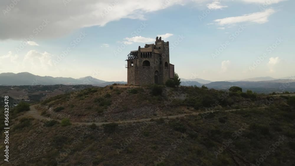 Aerial view of abandoned castle on top of the hill, moving up and tilting down Aerial view of abandoned castle on top of the hill, moving up and tilting down
