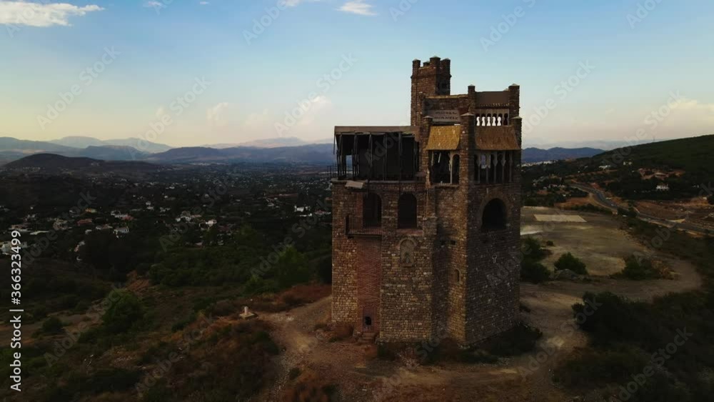 Dark aerial view of abandoned castle on top of a hill, South of Spain Dark aerial view of abandoned castle on top of a hill, South of Spain