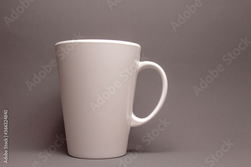 white plastic cup on gray background