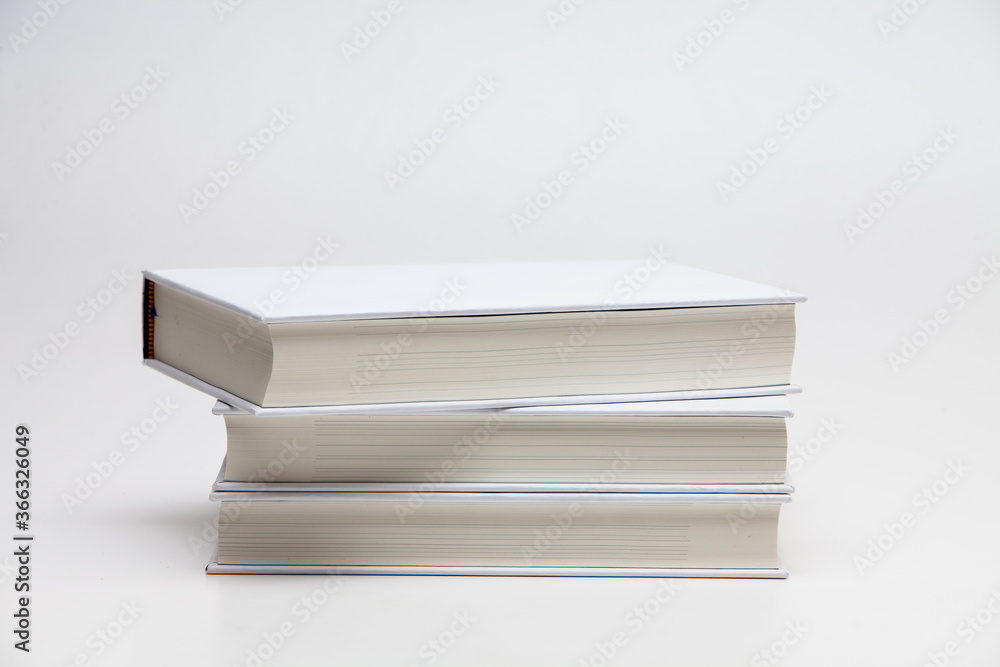 Pile Stacked white blank books on white background Pile Stacked white blank books on white background