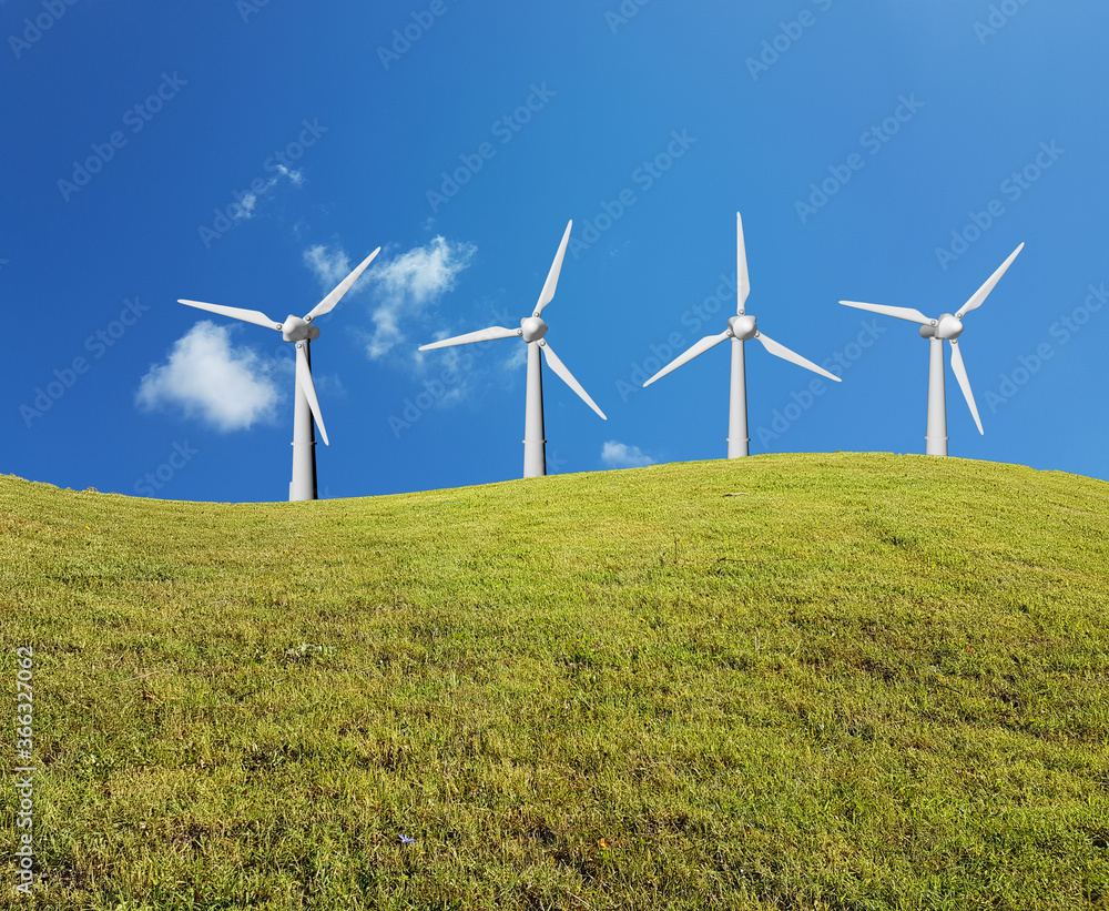 wind generators on grass lawn meadow and sky clouds in spring for background wind generators on grass lawn meadow and sky clouds in spring for background