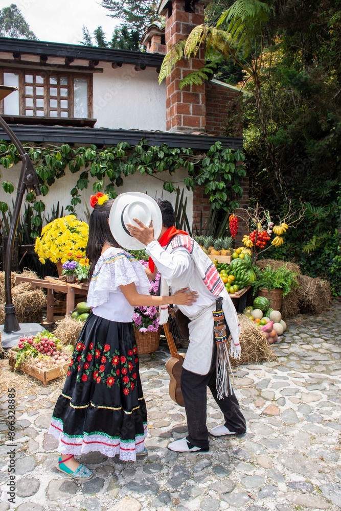 Couple with typical Antioqueño costume kissing
