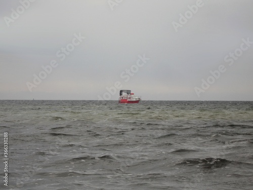 Lonely boat in the stormy sea