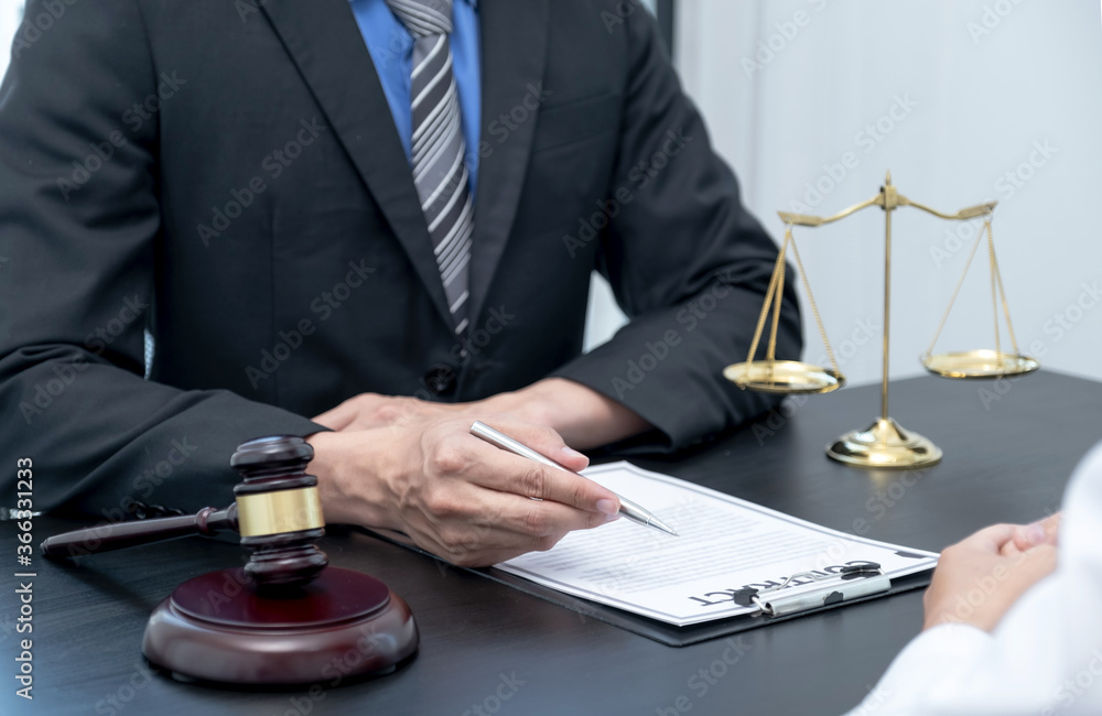 The male lawyer is providing service to consult business dispute to businessman The male lawyer is providing service to consult business dispute to businessman