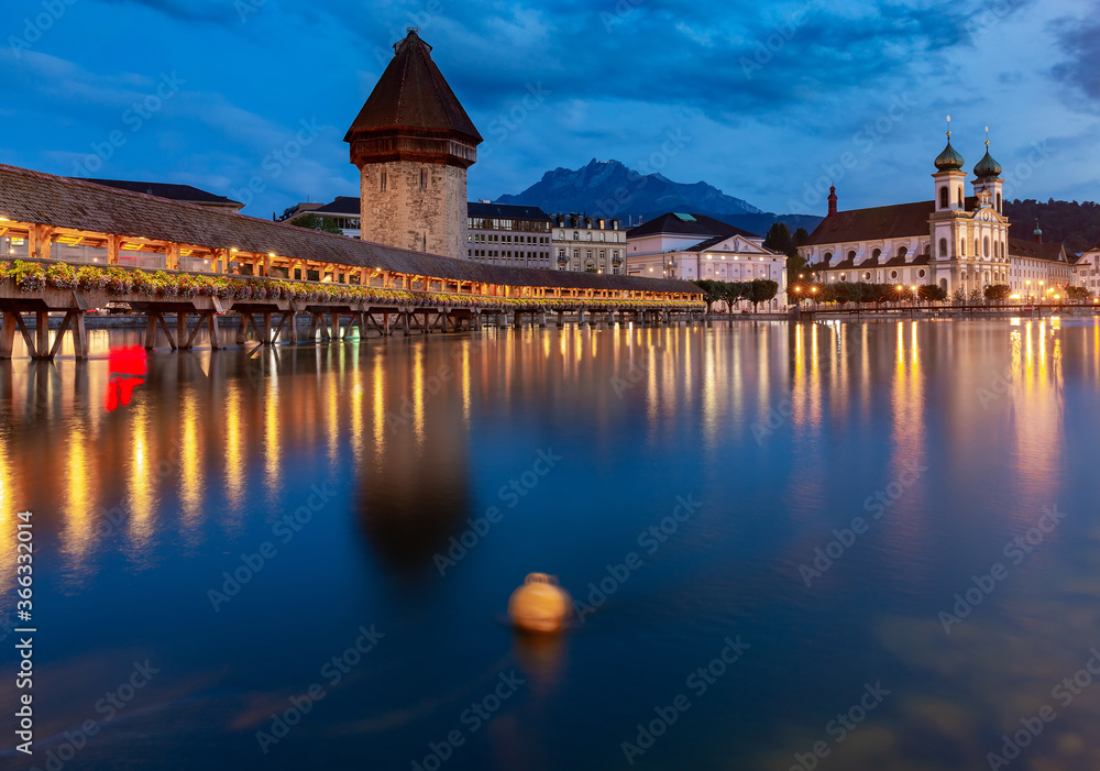 Lucerne. Old city embankment and medieval houses at dawn.