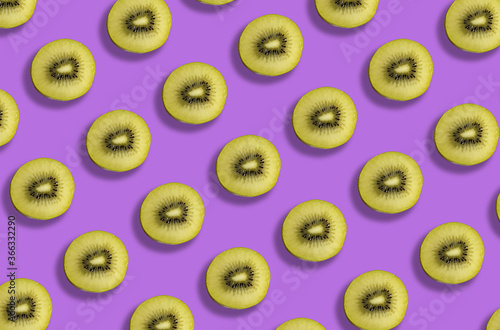 fresh gold kiwi fruit pattern on purple background
