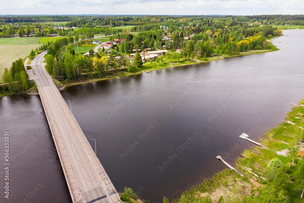 Fototapeta premium Aerial panoramic view of bridge in city Inkeroinen at river Kymijoki, Finland.