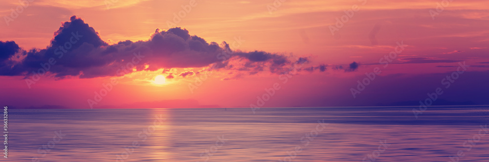beautiful sunset in the tropical sea at summer time for banner background, banner format