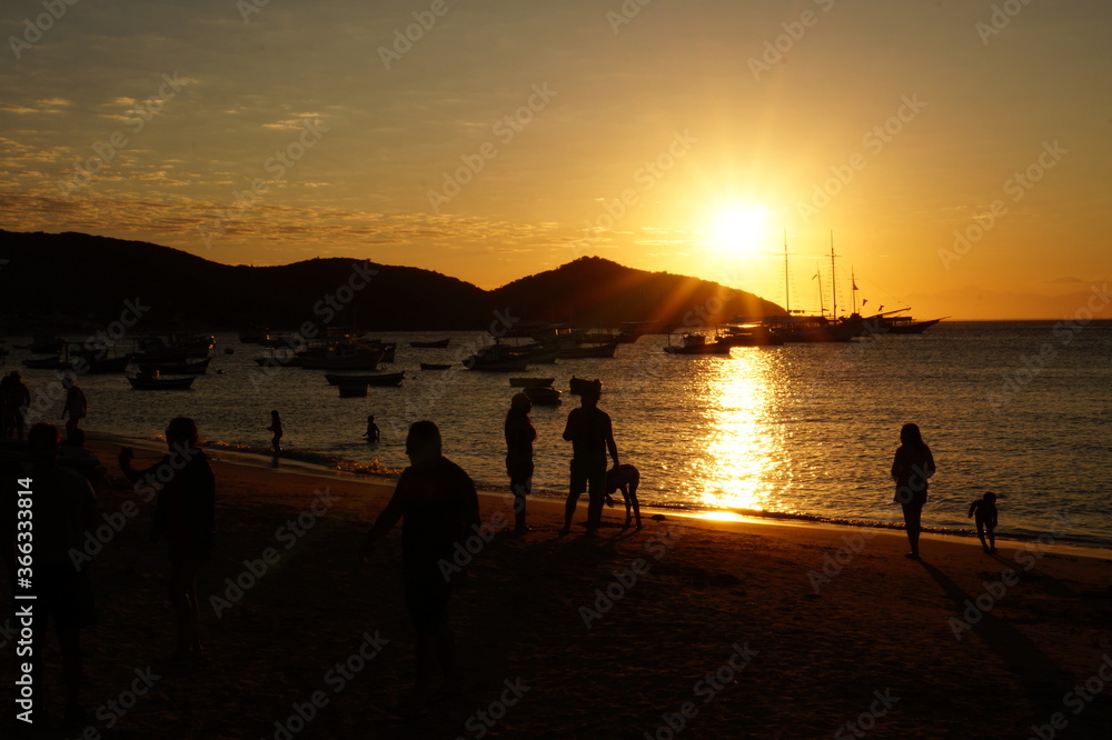 People enjoying sunset at Buzios beach, Brasil