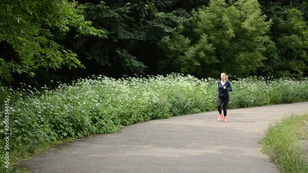 Young girl running in the stadium and stops Young girl running in the stadium and stops