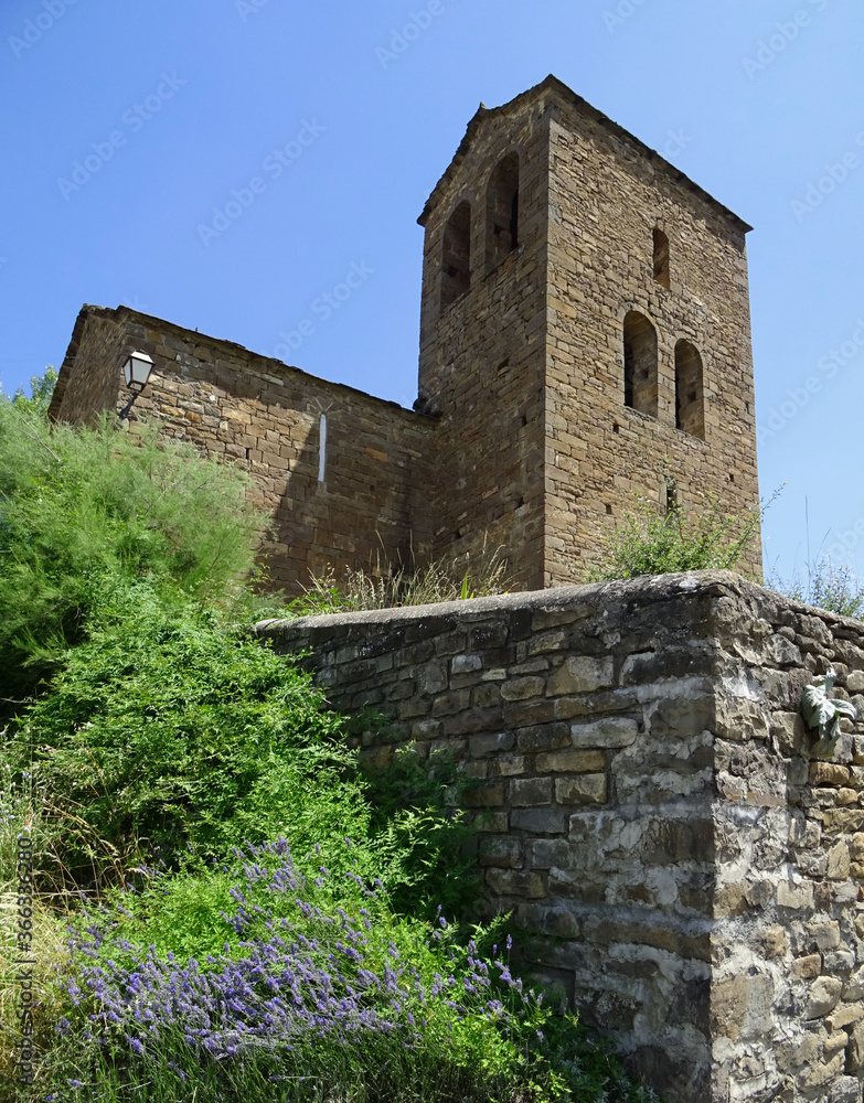View of the Bell tower of the Romanesque Church of San Andres in the village of Satue in the Serrablo Region. 11th century. Aragon. Spain.