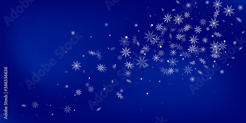 Snowflakes. Christmas snow, snowfall. Falling snowflakes on a blue background. White snowflakes fly in the air. Vector illustration © HALINA YERMAKOVA