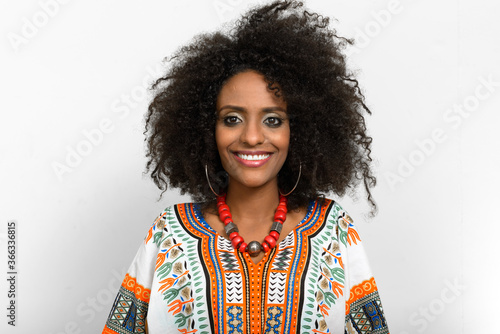 Young beautiful African woman with Afro hair wearing traditional clothes