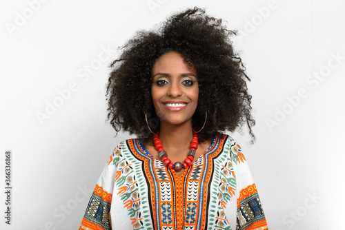 Young beautiful African woman with Afro hair wearing traditional clothes