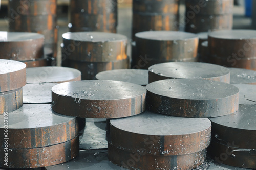 Obraz na plátně Round iron discs sawn on the saw are in the factory