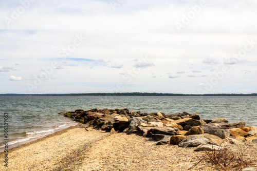 View of the harbor  beach and rocky headland in East Greenwich  Rhode Island