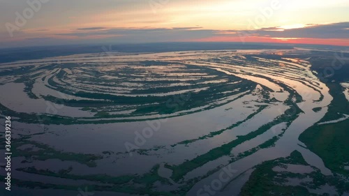 Flight over the water of Kama river in Russia at sunrise (Nizhnekamsk Reservoir) photo