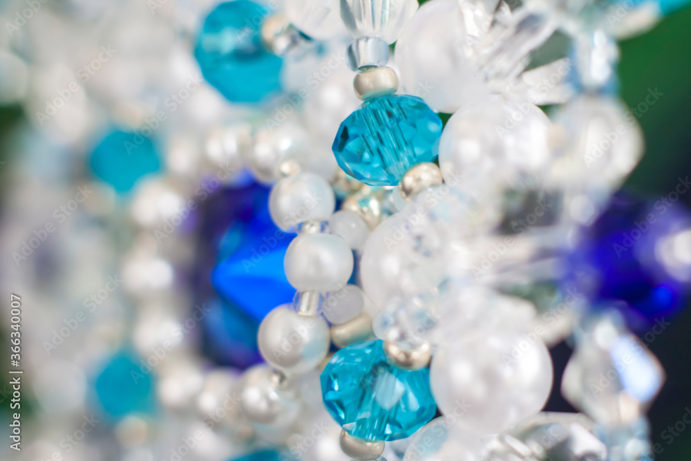 Background of abstract glittering lights. Blurred crystal beads for the background. de-focus. Use it as a background for your presentation. Background of abstract glittering lights. Blurred crystal beads for the background. de-focus. Use it as a background for your presentation.