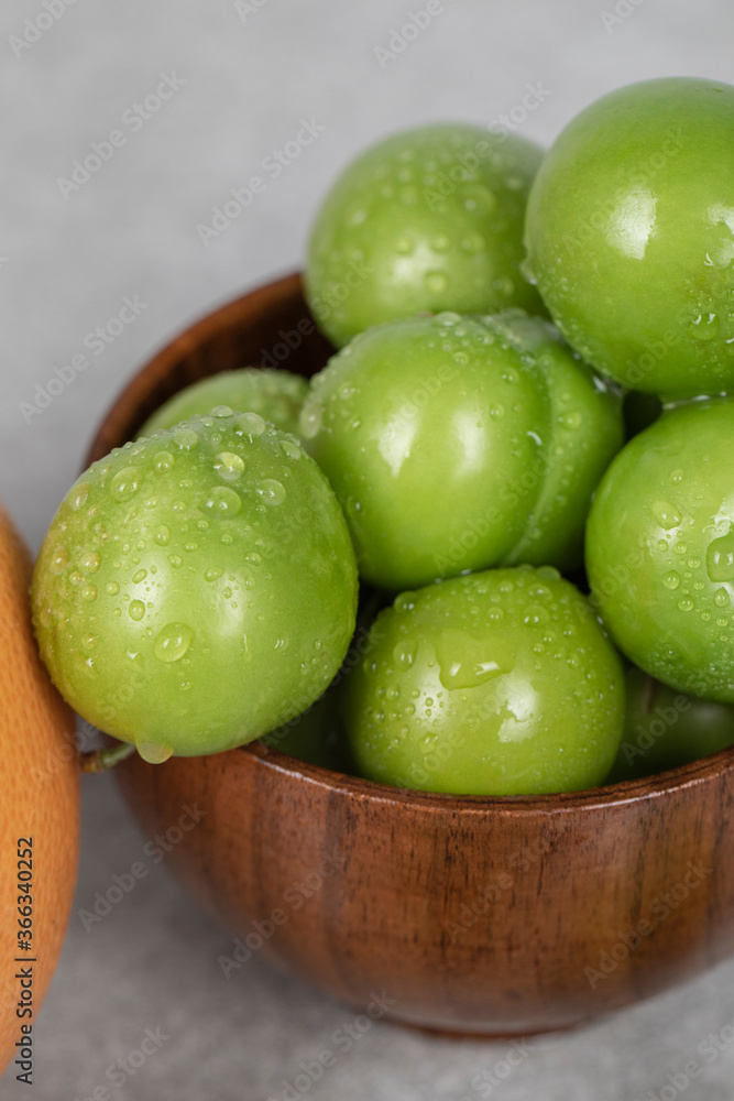 Cherry plums in the bowl with water drops on them Cherry plums in the bowl with water drops on them