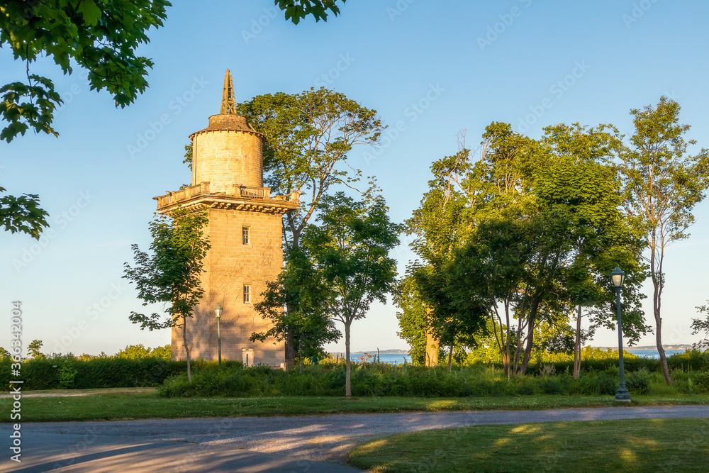 Fototapeta premium Beautiful view of the historic water tower in Harkness Memorial State Park, Connecticut, USA, on sunset