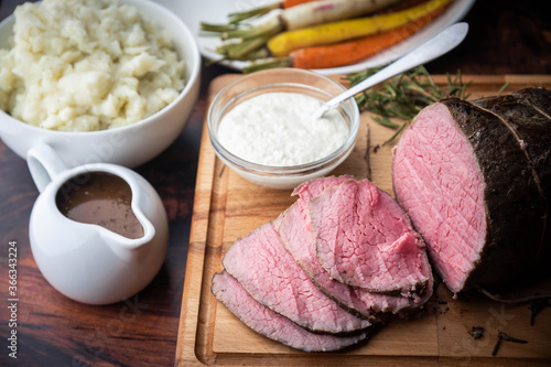 Bild auf Leinwand horseradish and gravy sauce with roast beef slices