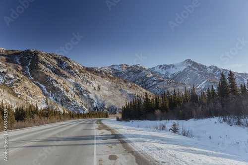Snowy mountains by the highway in Alaska