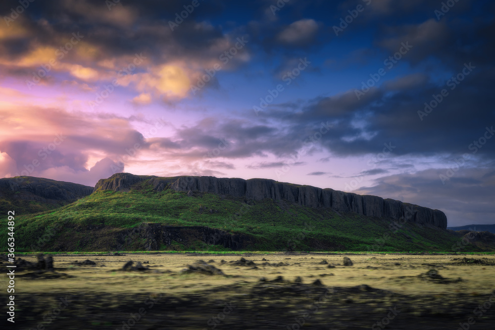 Iceland nature landscape at sunset. Blurred motion foreground