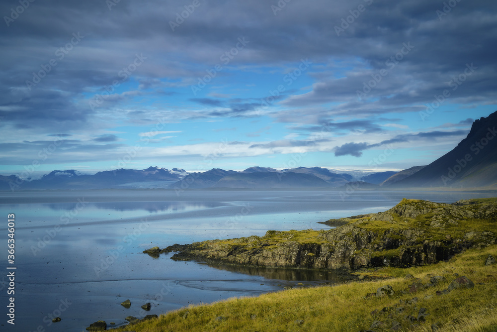 Glacier reflected on the water. View from Stokksnes. East Iceland landscape