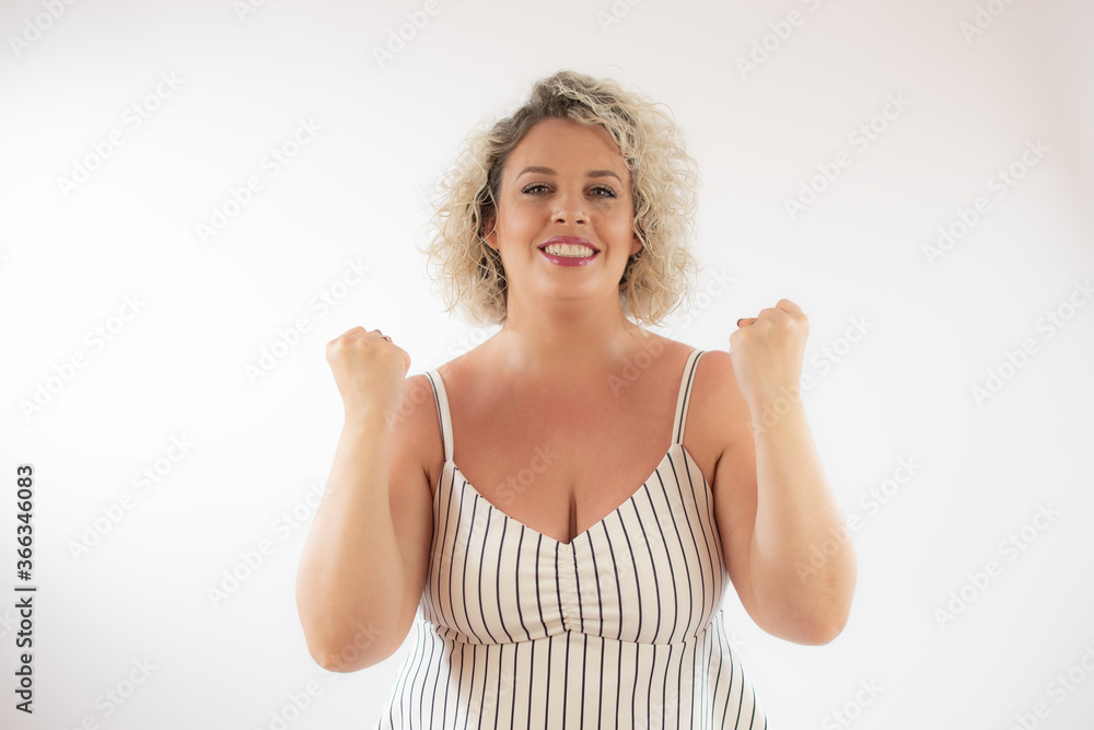 Blonde young woman making the winner gesture Blonde young woman making the winner gesture