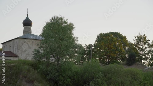 church and old stone tower early morning