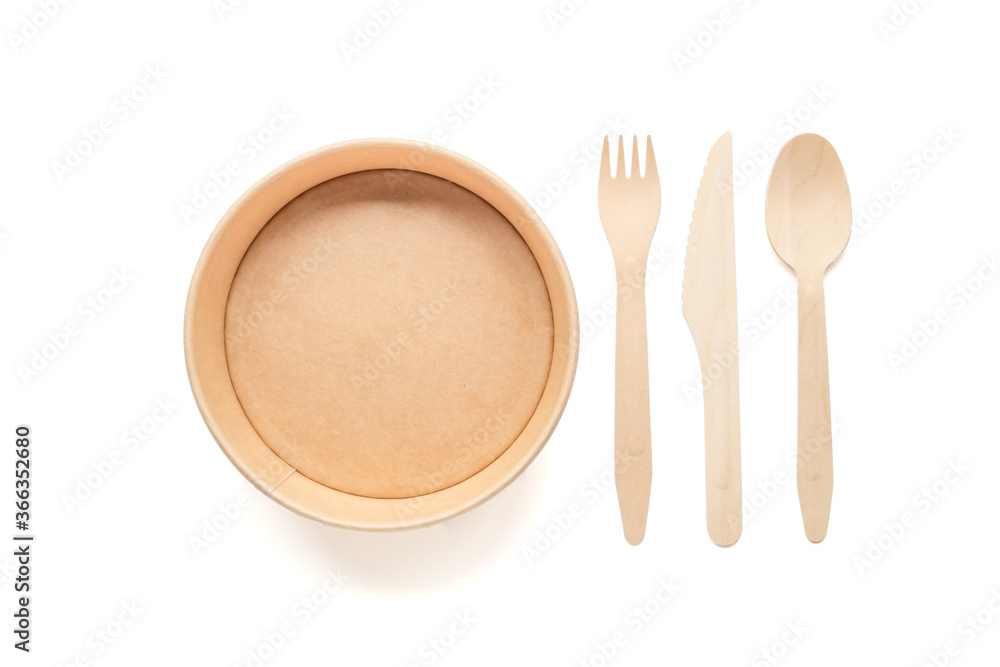 Zero waste concept. paper plate and wooden fork, spoon, knife isolated on a white background. Plastic rejection Zero waste concept. paper plate and wooden fork, spoon, knife isolated on a white background. Plastic rejection