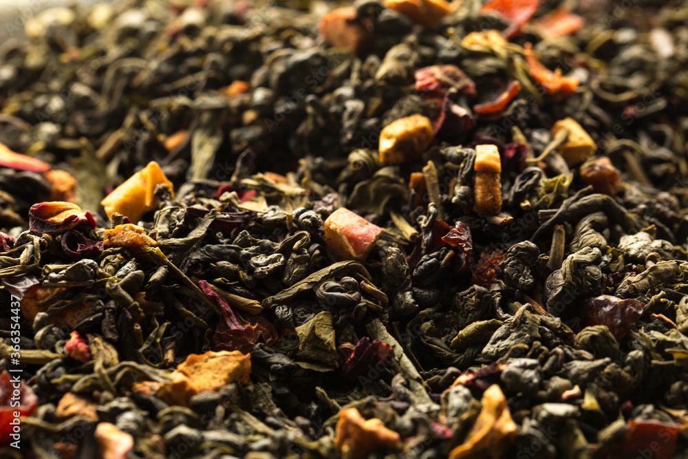 Leaves of Chinese Dry Tea Top Grade with Goji Berries and Powdered Acai on White Background Leaves of Chinese Dry Tea Top Grade with Goji Berries and Powdered Acai on White Background