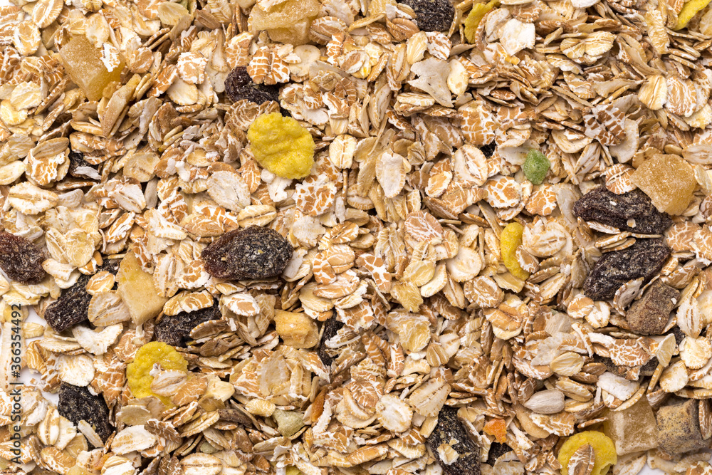 oatmeal with raisins, coconut, pineapple and banana slices isolated on a white background. For packing oatmeal or granola. oatmeal with raisins, coconut, pineapple and banana slices isolated on a white background. For packing oatmeal or granola.