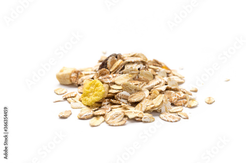 oatmeal with raisins, coconut, pineapple and banana slices isolated on a white background. For packing oatmeal or granola.