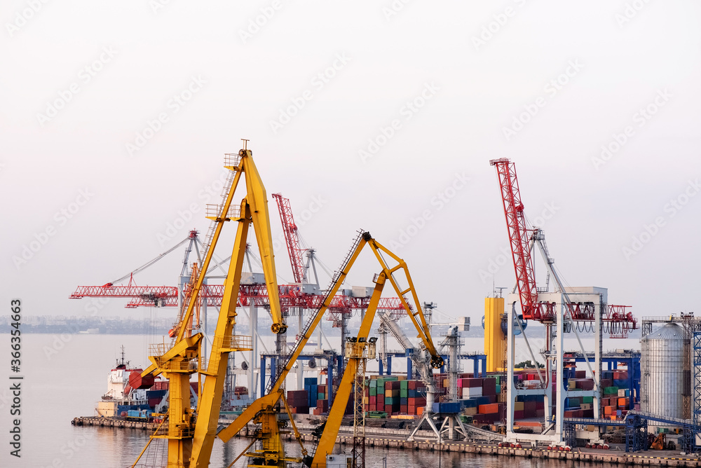 Trade Port. Shipping cargo to harbor.  Water International Transport.  International transportation. Container ship in export and import. Shipping cargo to harbor by crane.